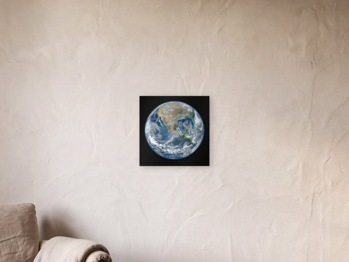 Blue Marble 2012 - Western Hemisphere shown in a limewash reading corner beside an armchair and a floor lamp - scale render at 40 × 40 cm