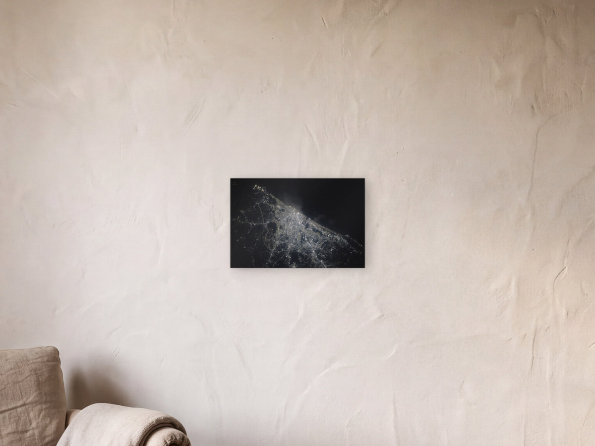 Chennai City Lights shown in a limewash reading corner beside an armchair and a floor lamp - scale render at 45 × 30 cm