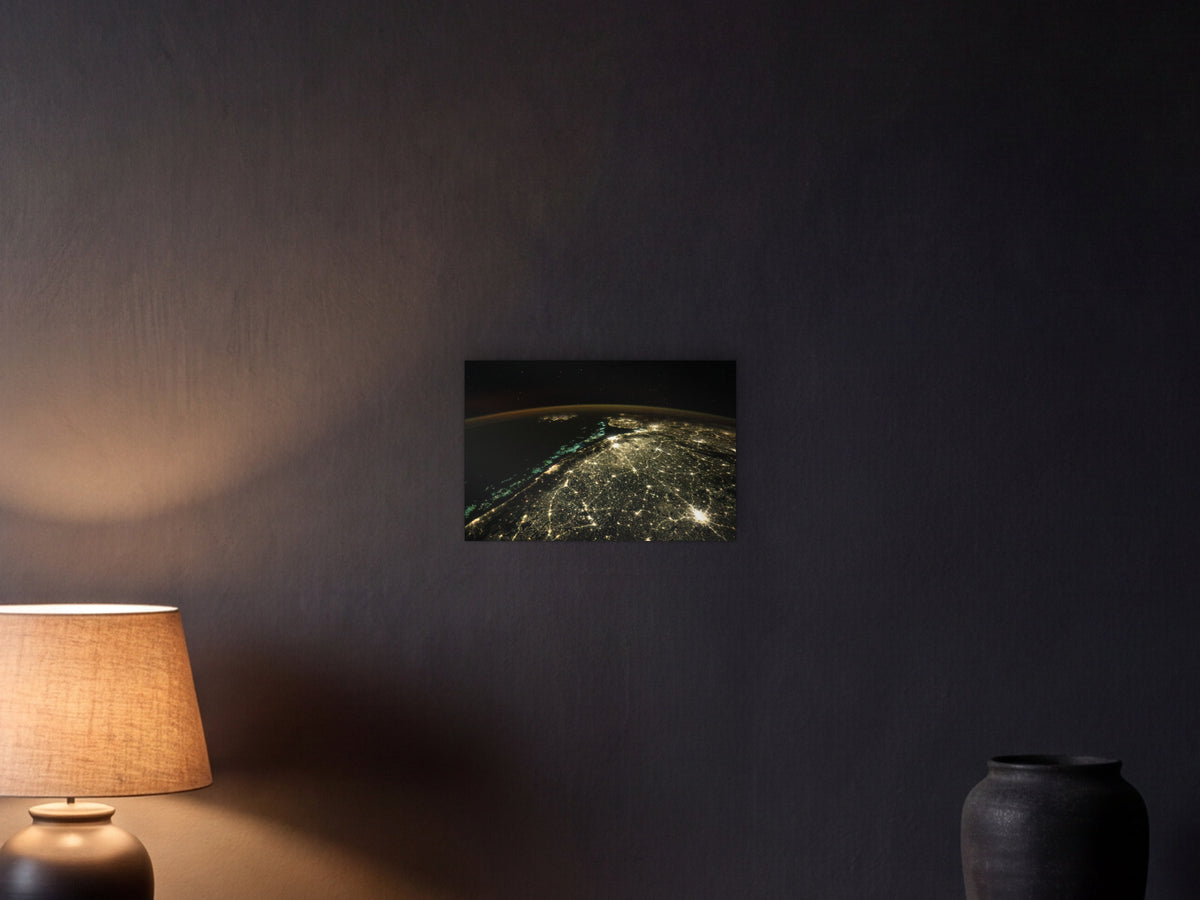 Fishing Boats and City Lights shown in a graphite plaster wall at night, lit by a console lamp - scale render at 45 × 30 cm