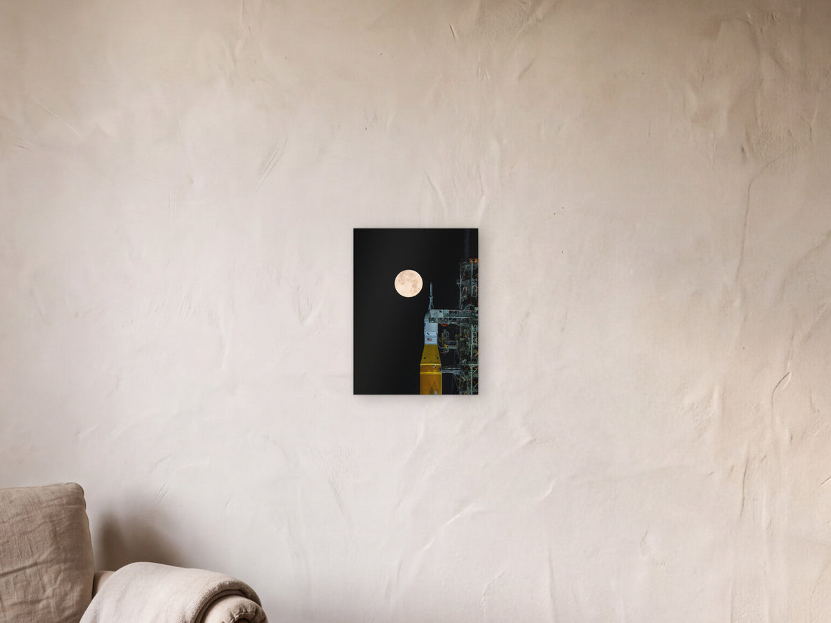 Full Moon over Artemis II shown in a limewash reading corner beside an armchair and a floor lamp - scale render at 30 × 40 cm