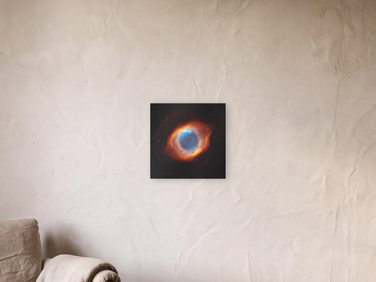 The Helix Nebula, NGC 7293 shown in a limewash reading corner beside an armchair and a floor lamp - scale render at 40 × 40 cm