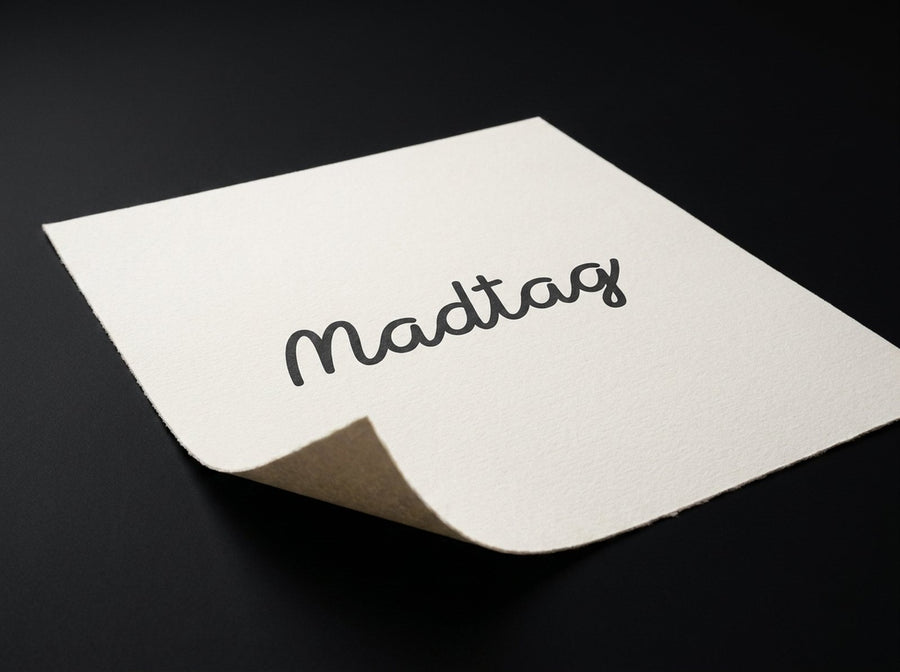 A Madtag print on a sheet of matte fine art paper, curling at one corner to show its thickness.