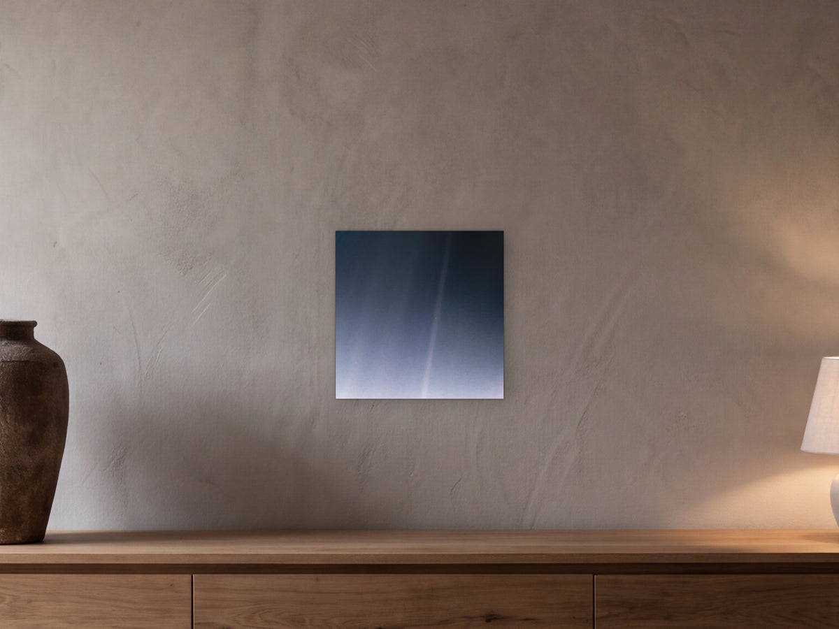 Pale Blue Dot Revisited (2020 remaster) shown in a beamed room with a greige plaster wall above a long oak sideboard - scale render at 40 × 40 cm