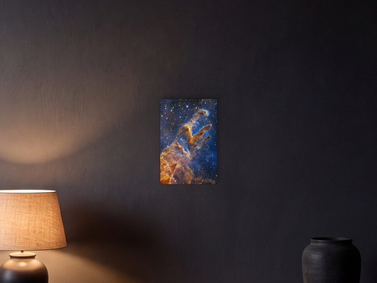 Pillars of Creation shown in a graphite plaster wall at night, lit by a console lamp - scale render at 30 × 45 cm