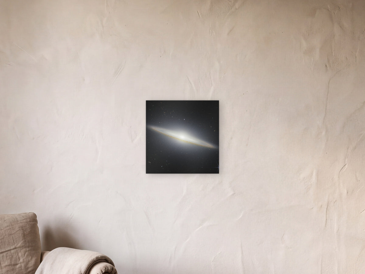 Sombrero Galaxy in Near-Infrared shown in a limewash reading corner beside an armchair and a floor lamp - scale render at 40 × 40 cm