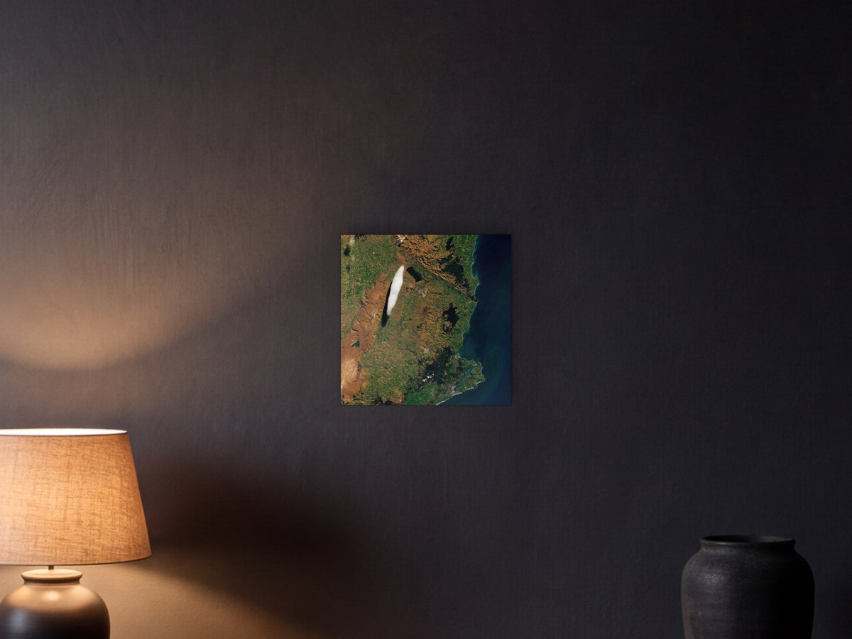 A Particular Lenticular Cloud shown in a graphite plaster wall at night, lit by a console lamp - scale render at 40 × 40 cm